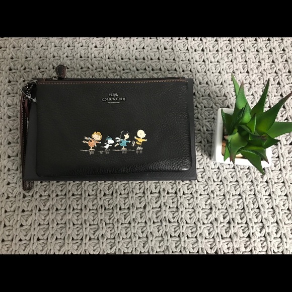 Coach Handbags - Limited Edition Coach x peanuts Wristlet Wallet .